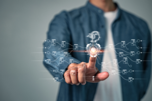 Person in a denim jacket taps a glowing AI interface with a circuit-network graphic in front of them