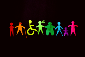 Rainbow-colored silhouettes of people with different abilities in a line, symbolizing diversity and inclusion.